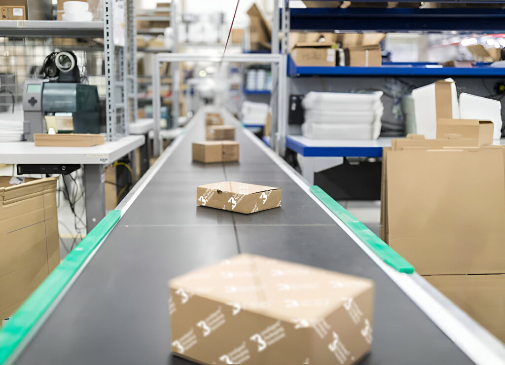 Boxes on a conveyor in a warehouse setting.